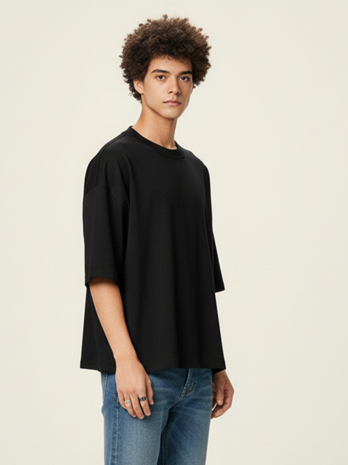Aero boxy crop tee in black by Apollo Moda, oversized fit worn with blue jeans